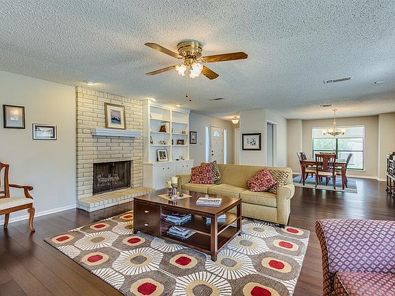 This view shows the fireplace with gas logs and is adjacent to the formal dining area.
