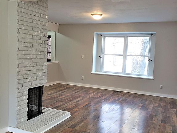 beautiful laminate floor in living room and hardwood floor in dining room