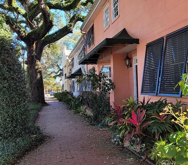 Located on beautiful historic East Jones St. Walk to all downtown shops, restaurants, museums and parks.. In a safe gated secure complex with courtyard, bike rack and assigned parking space.