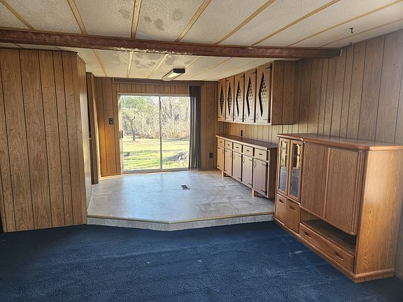Dining room with lots of storage. Sliding door provides access and view to back yard. Entertainment center is free for you to keep, or I will move it out.