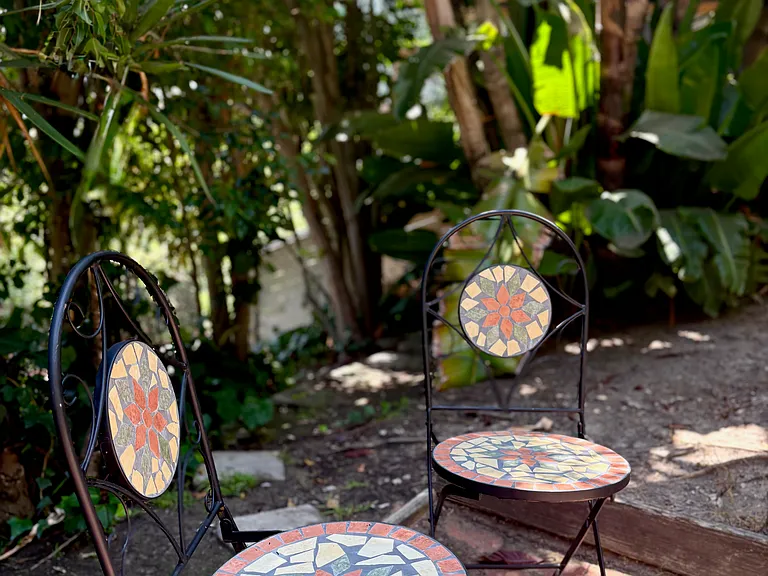 Charming mosaic wrought-iron cafe table for another peaceful spot to relax.
