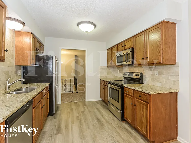 5905 NW Whispering Oaks Ln — Photo 6