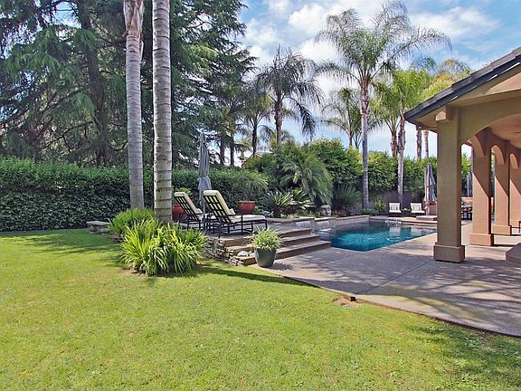 Ideally located on an enviable pie-shaped lot that fans out to give outdoor space where you enjoy it most! Sized at over 1/3 acr
