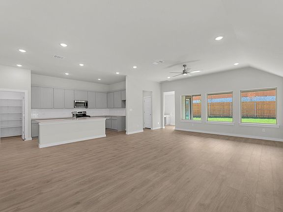 Kitchen in the Pecos home plan by Trophy Signature Homes - REPRESENTATIVE PHOTO