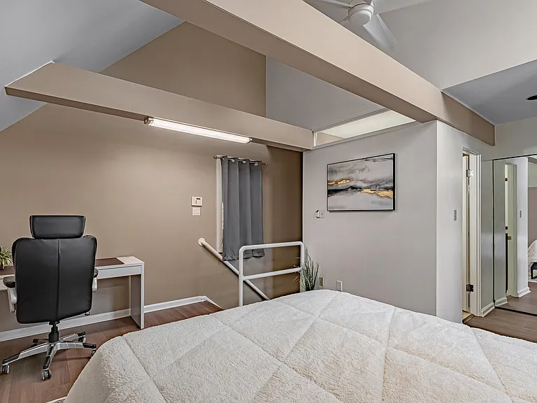 3rd floor bedroom with 16 ft. vaulted ceiling; ALL new furniture (but not photographed yet) -- updated photos after the tenant moves out