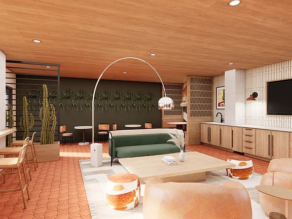 Lounge with gathering space, comfortable seating, and shuffleboard at Modera Rio Salado in Tempe, AZ.