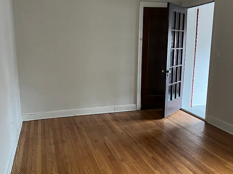 Bedroom showing door to the enclosed Sunroom