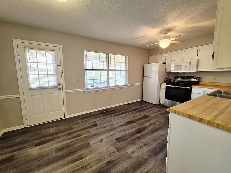 Bright kitchen with plenty of workspace and cabinets for all your essentials.