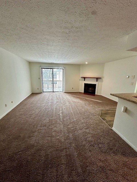 Another view of living room- sliding glass door to the balcony