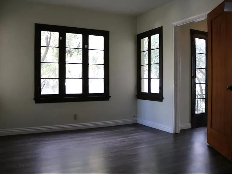 The formal dining room area -- note the floor to ceiling French doors-- and drenching of SoCal sunlight