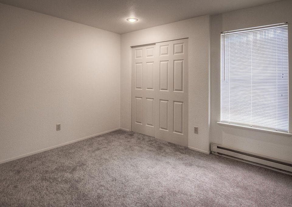 Newly installed carpet and closet doors in bedrooms