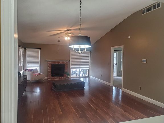 Living room facing rear patio and master bedroom.
