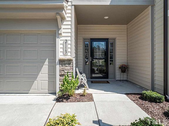 This Home will wow you!! Many Many upgraded features throughout this nearly new home! Welcoming covered rocking chair front porch! Storm Door and Designer front glass door!