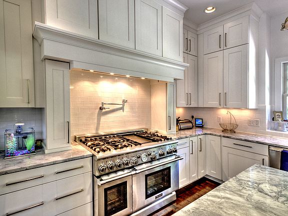 Fabulous Kitchen with a 48" Sub-Zero stainless refrigerator, Bosch dishwasher and 48" professional Thermador range complimented by Miele hood and pot filler.  Shaw's English, Fireclay Farmhouse Sink.