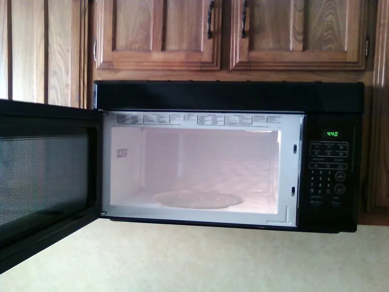 2 year old microwave above stove