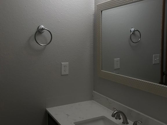Upstairs bathroom with new solid surface counter tops.