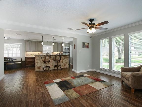 Dining area open to remodeled kitchen with stone under bar (no kid scuff marks)Can accommodate large dining table!