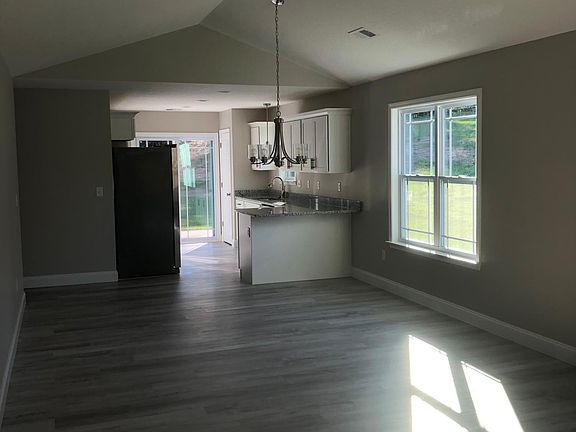 Front door looking to kitchen
