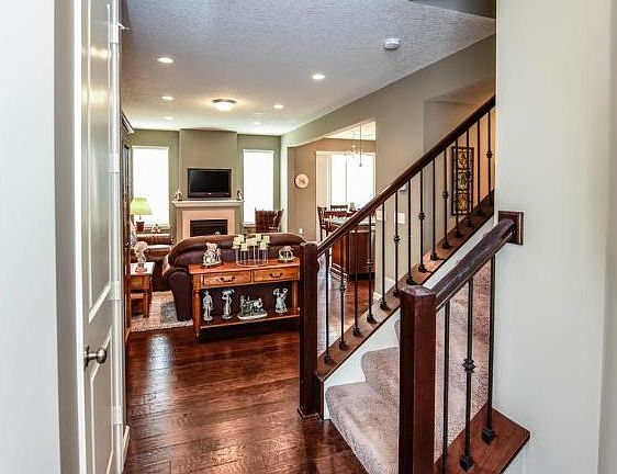 Dark hardwood flooring throughout the main level.
