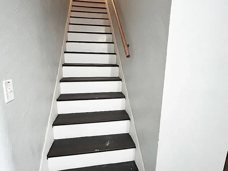 Stairway to basement Bedroom and office/bonus room