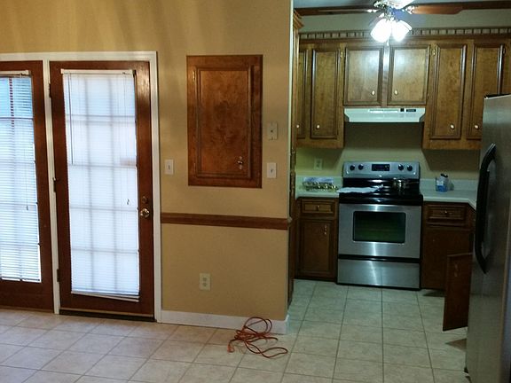 Kitchen and dining open into living room