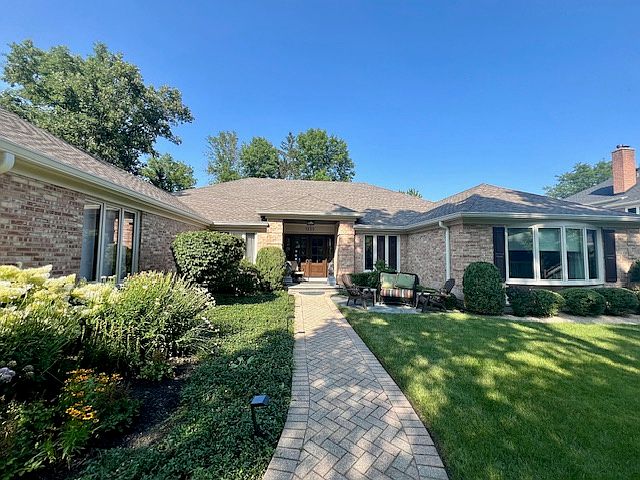 South facing front door. Home is set back & higher elevation from the street.