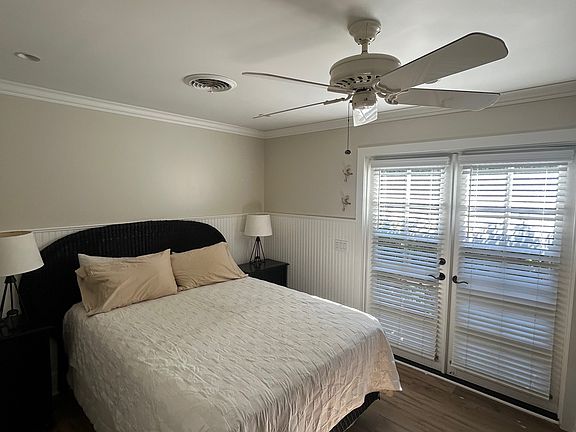main bedroom with ensuite pictured with queen size bed