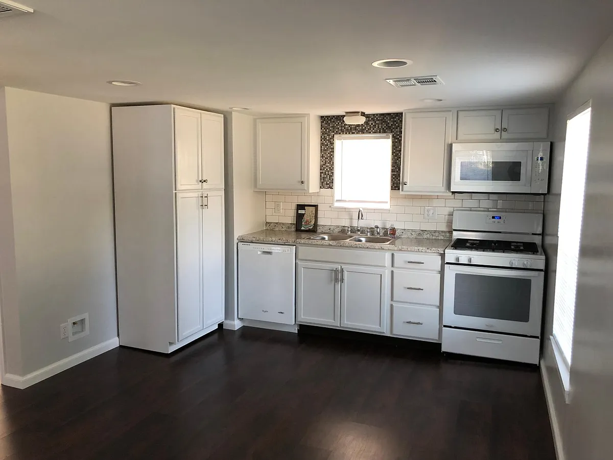 Although not pictured, there is a white refrigerator next to the cabinets on the left. - 210 E Mosier St