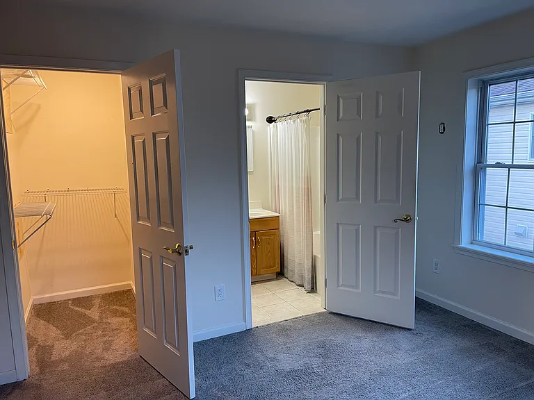 Bedroom with ensuite bath and closet.