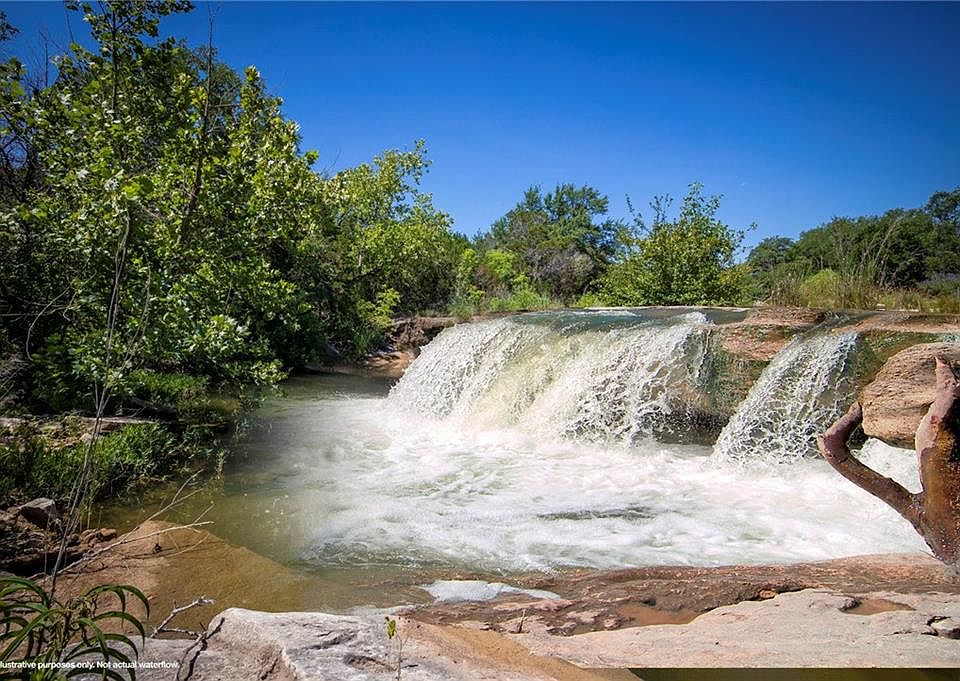 Water pouring from water mill chute] - The Portal to Texas History