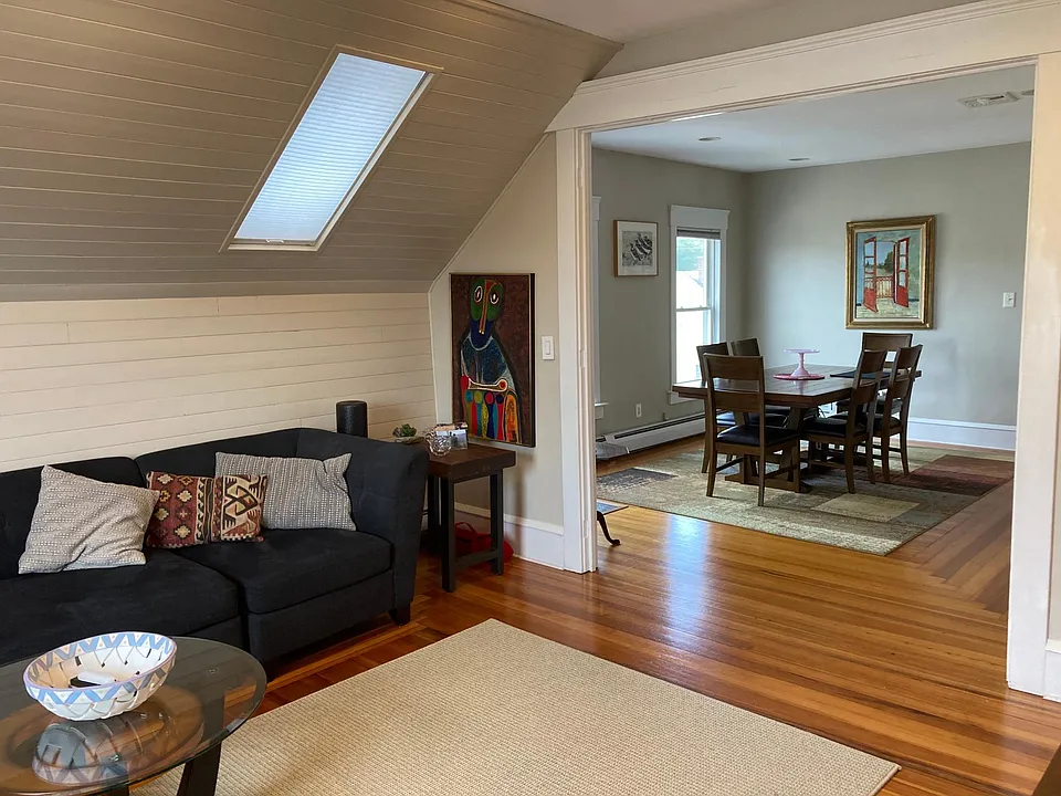 Shiplap on living room wall. Looking into dining room