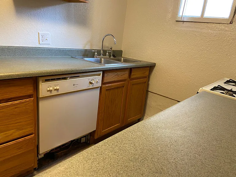 Kitchen looking right to left photo #3. Full double basin sink with garbage disposal and full size dishwasher