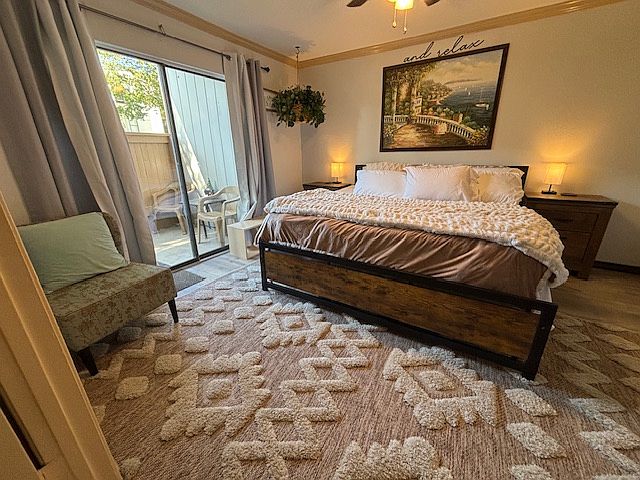 The room has access to a patio and includes a walk-in closet.