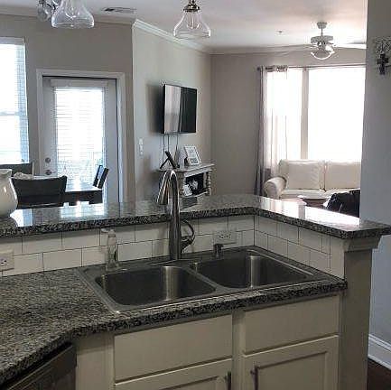 Kitchen looking into living room/dining area