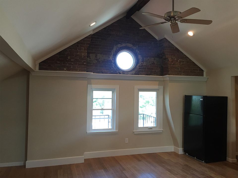 Stunning Cathedral Ceiling w/ Exposed Brick Gable