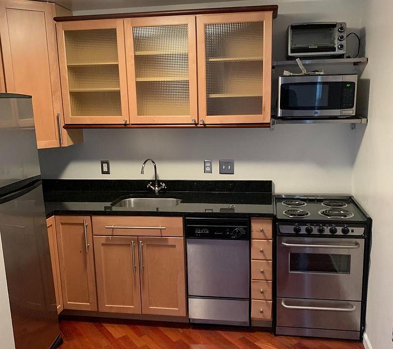Full kitchen area with a toaster oven and a microwave!