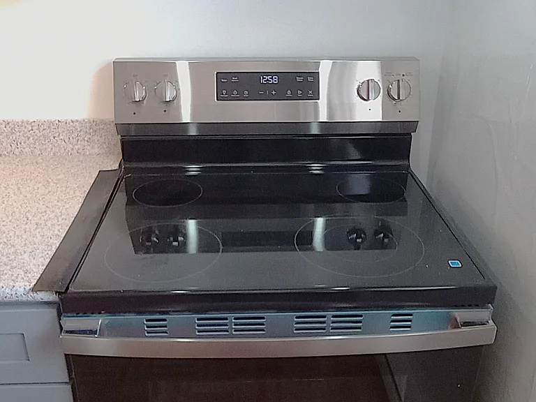Stove with above-the stove exhaust fan