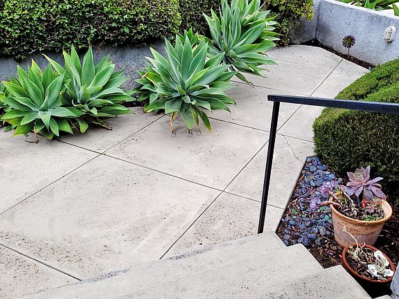 Charming Front Patio is Enclosed With View to Friendly Neighborhood