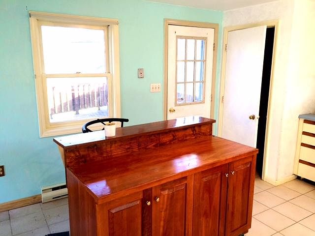 Rolling island with storage and bar stools