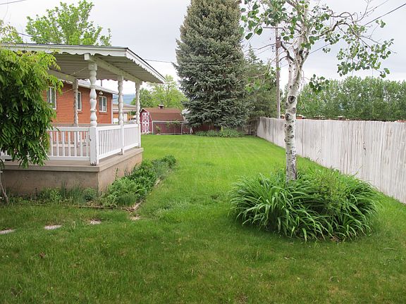 fully fenced w/mature trees