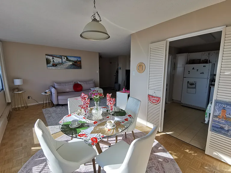 Another look at the dining room plus kitchen and living room.