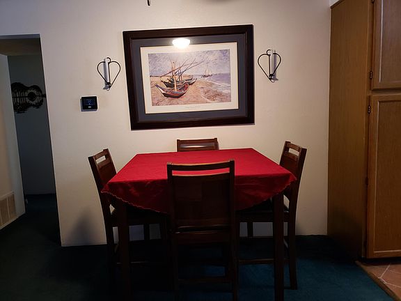 dining area, carpet shown here has been replaced with a grey tone throughout the condo.