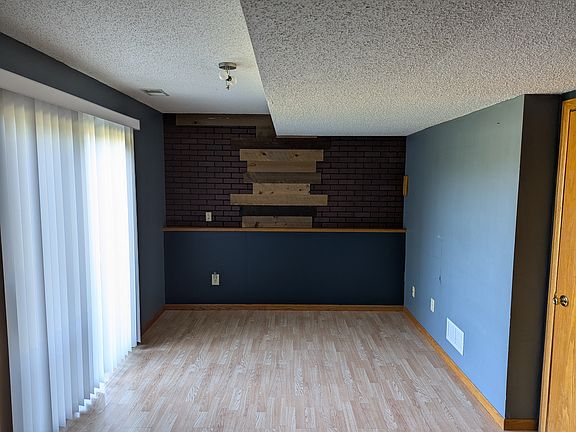 Basement family room with patio door to backyard