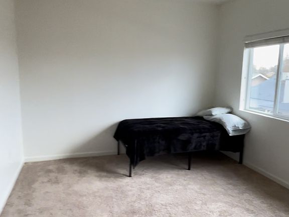 Room 4 Vacant with walk-in closet facing front of house.