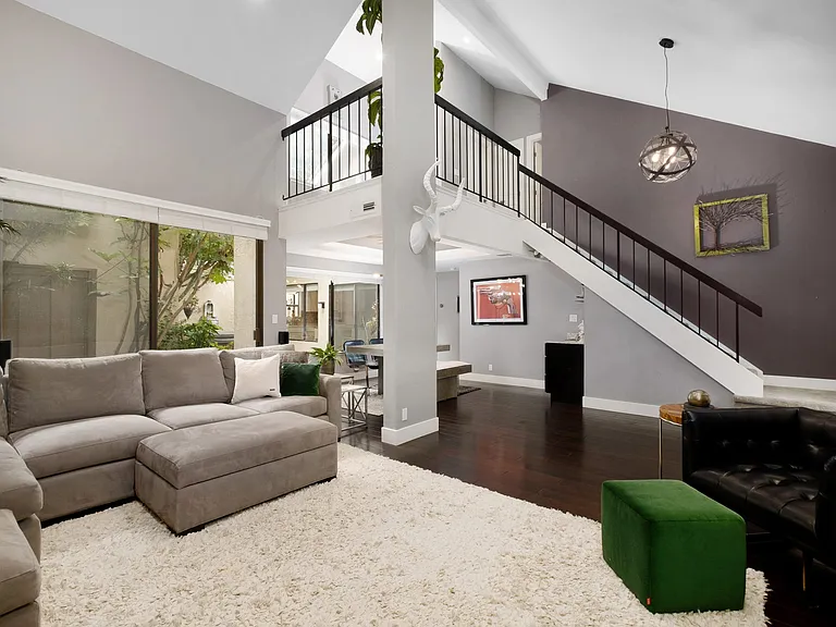 Relax in your stylish & fun living room, huge couch, high vaulted ceilings, Large HD TV, Sonos surround sound & super cozy Gas Fire Place