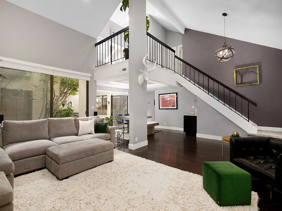 Relax in your stylish & fun living room, huge couch, high vaulted ceilings, Large HD TV, Sonos surround sound & super cozy Gas Fire Place
