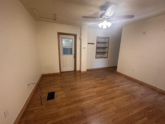 Living room, bedroom to the right, front door