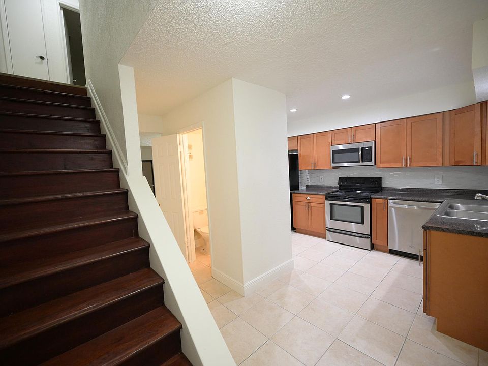 When you walk into the apartment , the stairs on the left ,and the hall way and powered room is in the middle and Livingroom and the Kitchen on the right