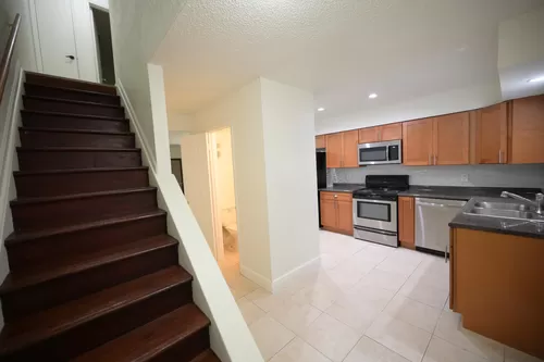 When you walk into the apartment , the stairs on the left ,and the hall way and powered room is in the middle and Livingroom and the Kitchen on the right - 140 Lime Rd