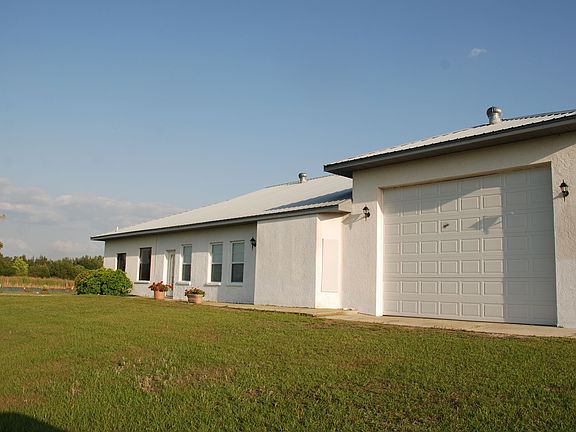 Back side of house 12' h Motor home garage